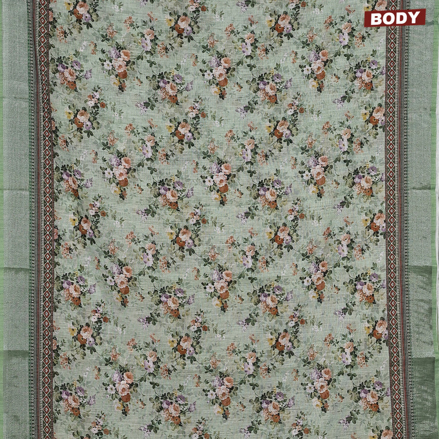 Linen cotton saree pastel green with allover floral prints and silver zari woven border