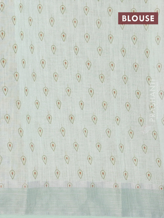 Linen cotton saree pista green with allover floral prints and silver zari woven border