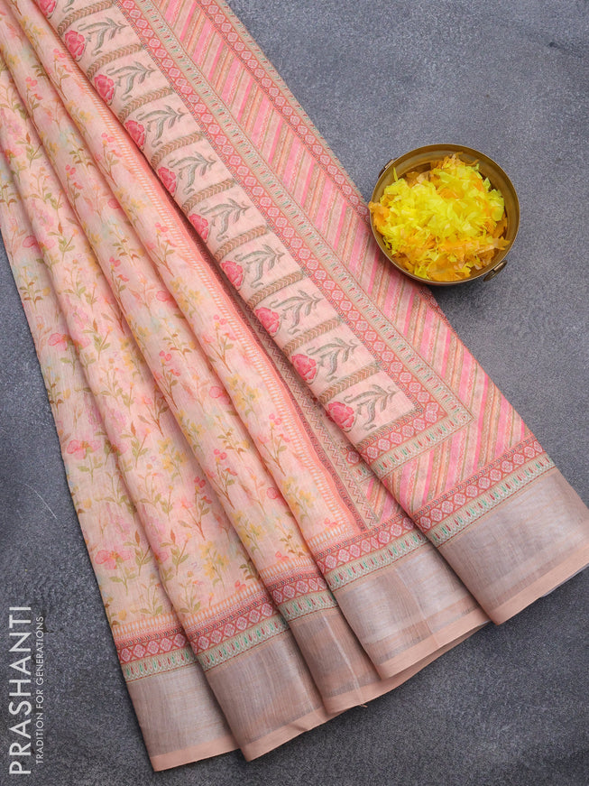 Linen cotton saree peach orange with allover floral prints and silver zari woven border