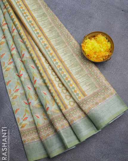 Linen cotton saree pastel green with allover prints and silver zari woven border