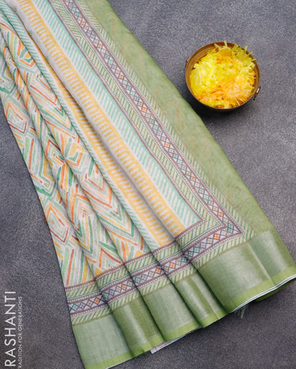 Linen cotton saree off white and light green with allover geometric prints and silver zari woven border