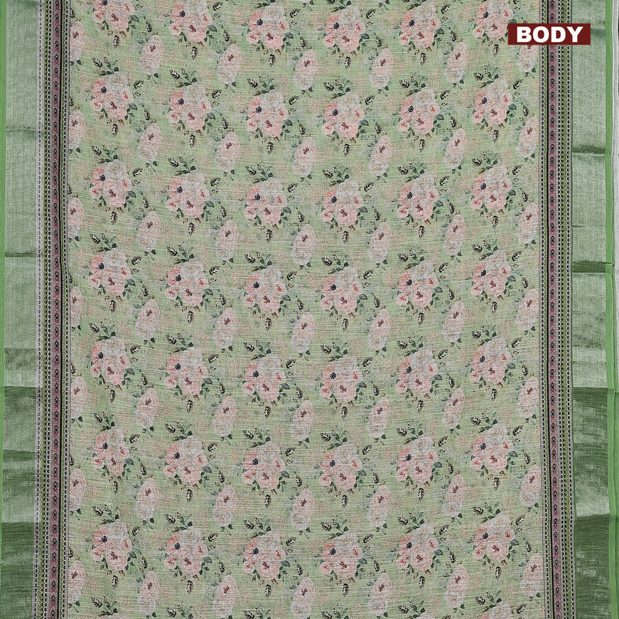 Linen cotton saree green with allover floral prints and silver zari woven border