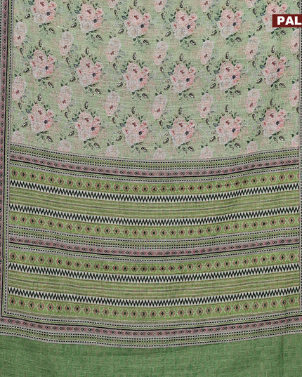 Linen cotton saree green with allover floral prints and silver zari woven border