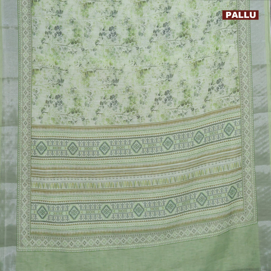 Linen cotton saree light green with allover prints and silver zari woven border