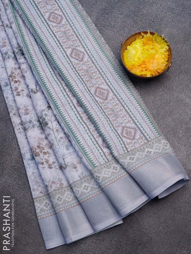 Linen cotton saree grey shade with allover prints and silver zari woven border