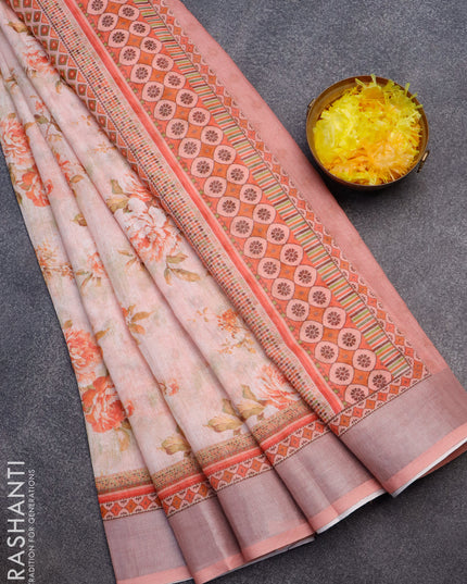 Linen cotton saree mild peach with allover floral prints and silver zari woven border
