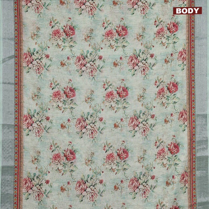 Linen cotton saree teal green with allover floral prints and silver zari woven border