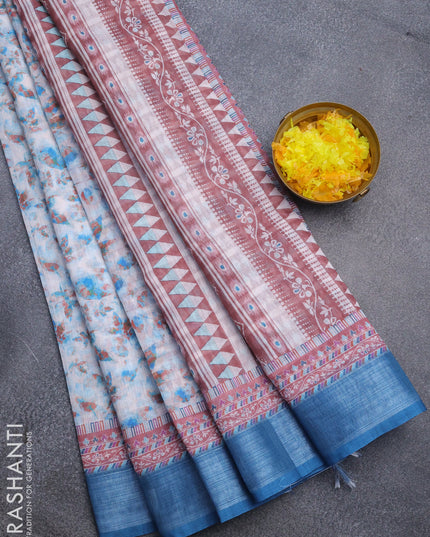 Linen cotton saree off white and peacock blue with allover leaf prints and silver zari woven border