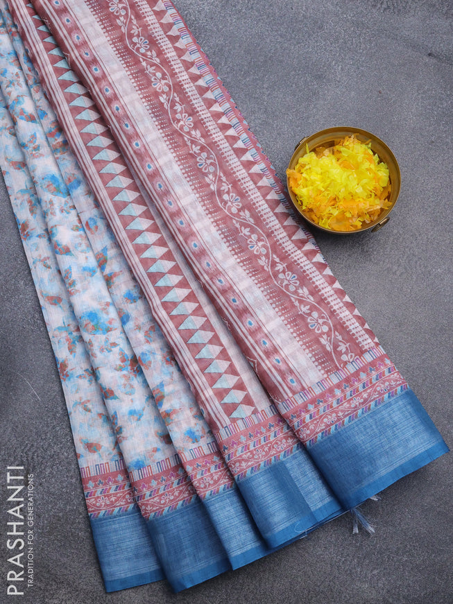 Linen cotton saree off white and peacock blue with allover leaf prints and silver zari woven border