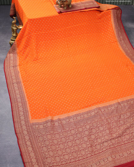 Pure banarasi crepe silk saree orange and maroon with allover thread & zari woven butta weaves and floral woven border