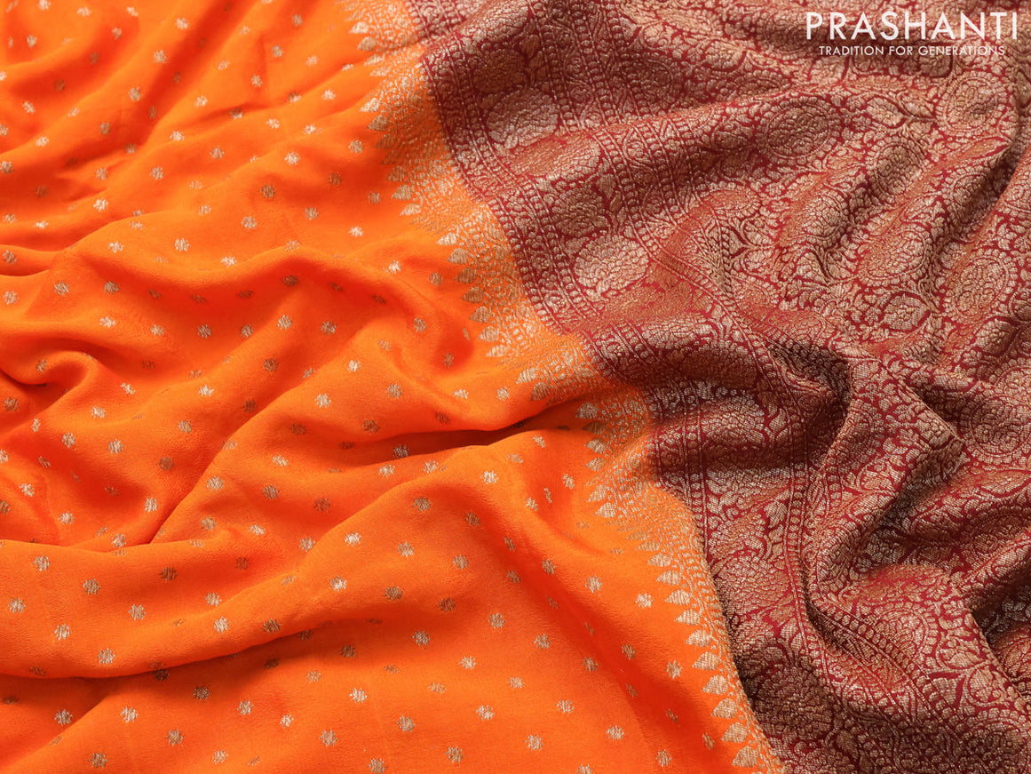 Pure banarasi crepe silk saree orange and maroon with allover thread & zari woven butta weaves and floral woven border