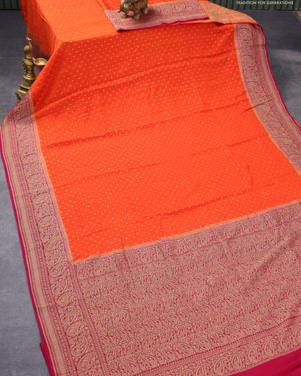 Pure banarasi crepe silk saree orange and dark magenta pink with allover thread & zari woven geometric butta weaves and paisley woven border
