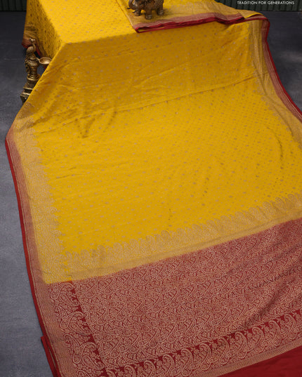 Pure banarasi crepe silk saree mustard yellow and rustic brown with allover thread & zari woven floral butta weaves and paisley woven border