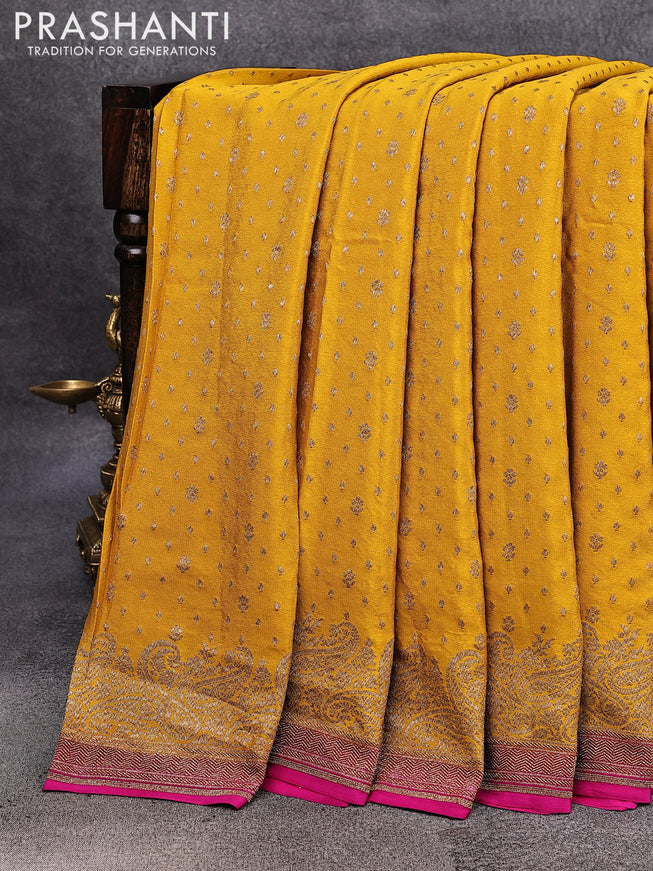 Pure banarasi crepe silk saree mustard yellow and pink with allover thread & zari woven floral butta weaves and paisley woven border