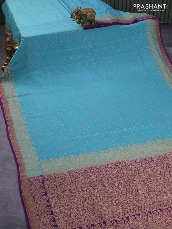 Pure banarasi crepe silk saree pastel blue and purple with allover thread & zari woven floral butta weaves and paisley woven border