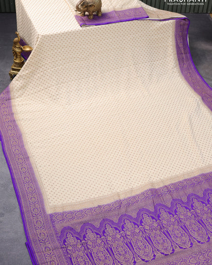 Pure banarasi crepe silk saree cream and violet shade with allover thread & zari woven butta weaves and woven border