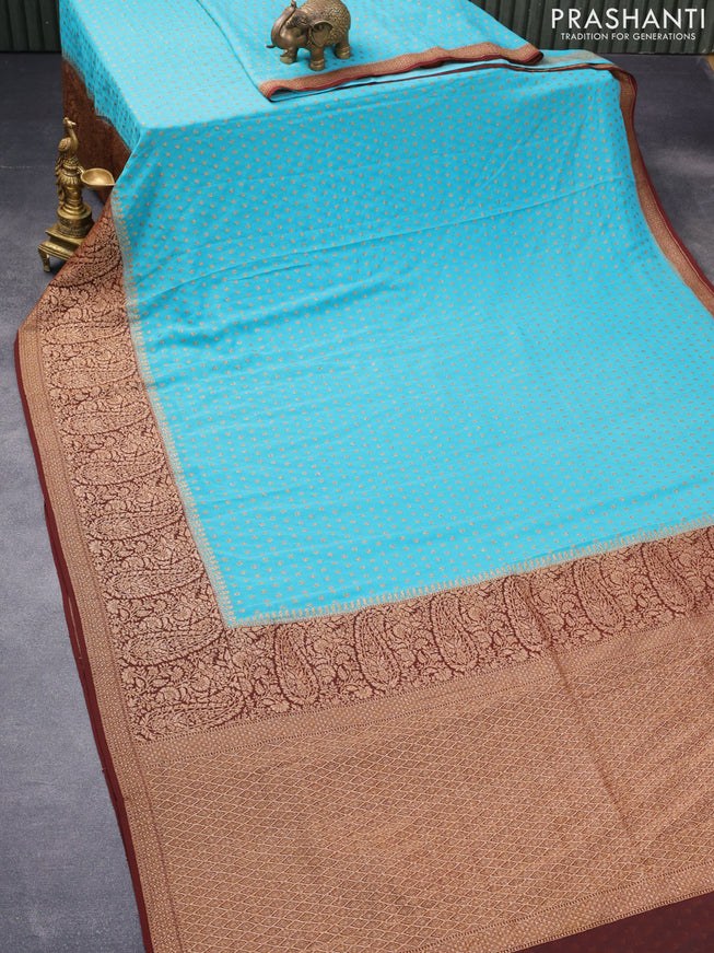 Pure banarasi georgette silk saree teal blue and deep maroon with allover thread & zari woven floral butta weaves and long woven border