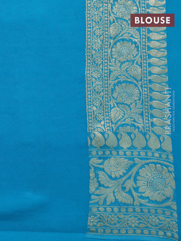 Pure banarasi georgette silk saree teal blue with allover zari woven floral brocade weaves and rich floral zari woven border