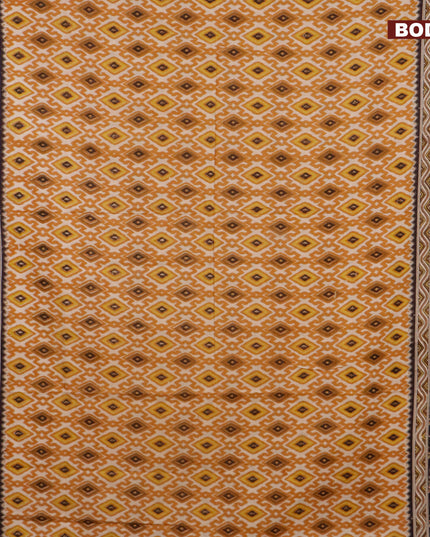 Kalamkari cotton saree beige mustard yellow and black with allover ikat weaves and printed border
