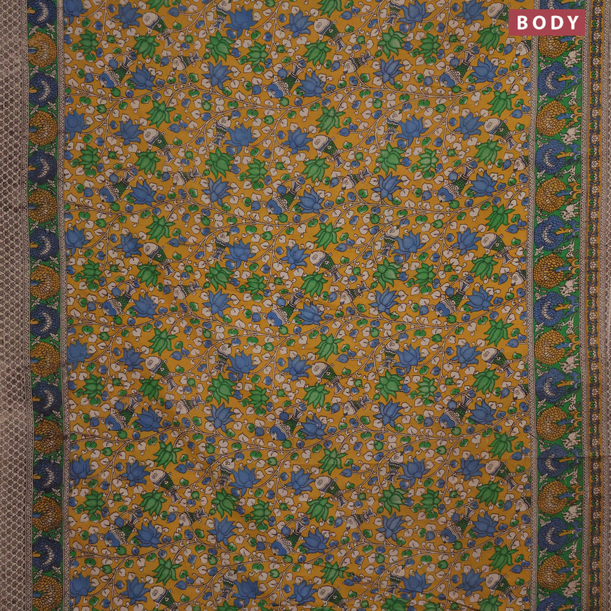 Kalamkari cotton saree mustard yellow and green with allover prints and printed border