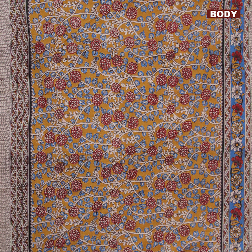 Kalamkari cotton saree dark mustard and blue with allover prints and printed border
