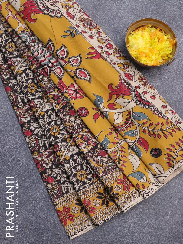 Kalamkari cotton saree black and mustard yellow with allover prints and printed border
