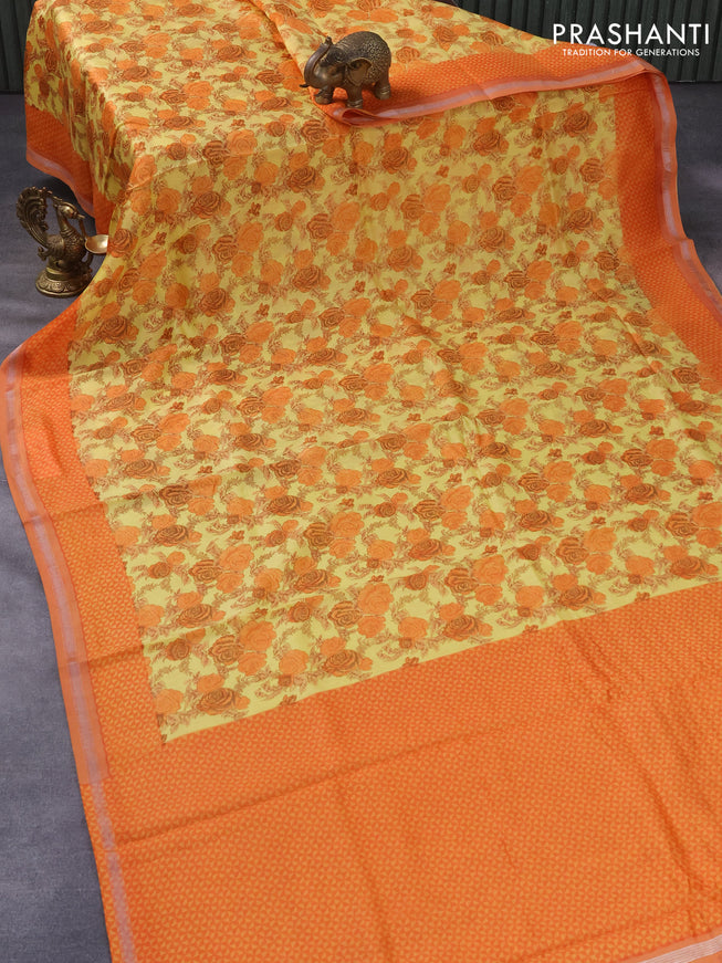 Chanderi silk cotton saree pale yellow and orange with allover floral prints and samll zari woven border
