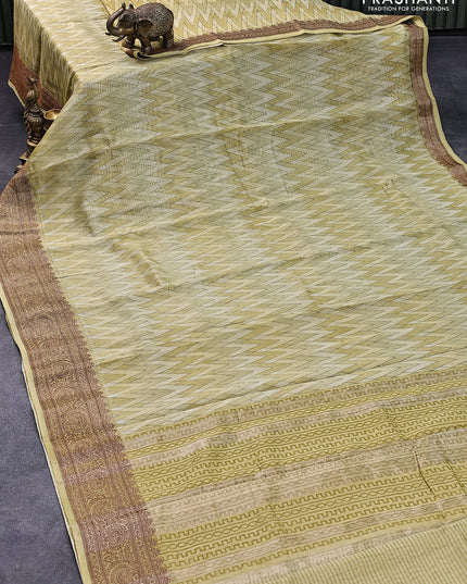 Chanderi silk cotton saree elaichi green with allover zig zag prints and woven border