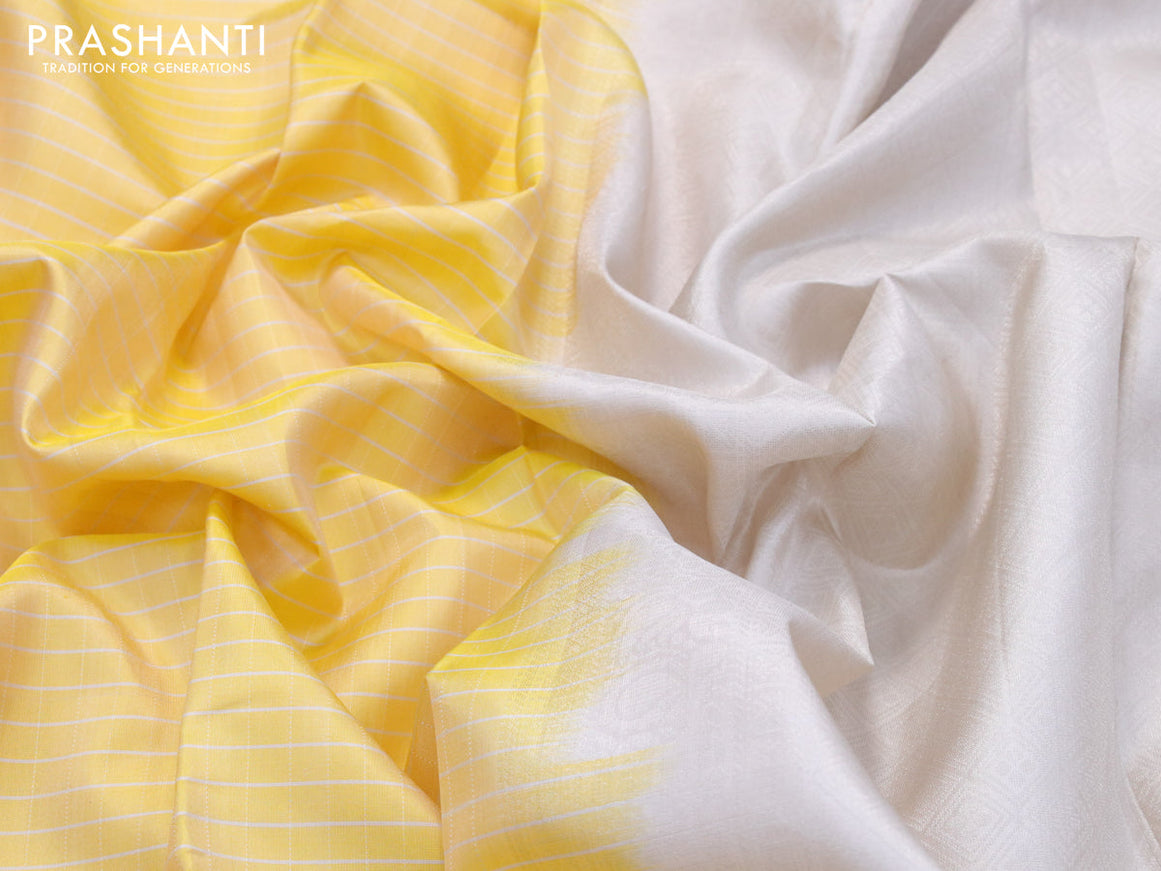 Pure soft silk saree yellow and grey shade with allover checked pattern and rettapet silver zari woven border