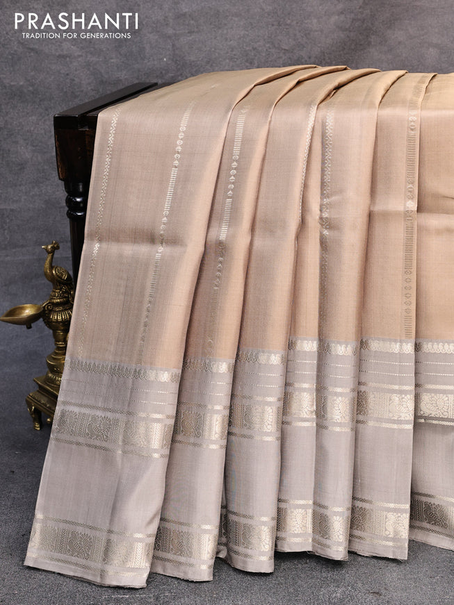 Pure soft silk saree beige and grey shade with allover zari weaves and rettapet long zari woven border