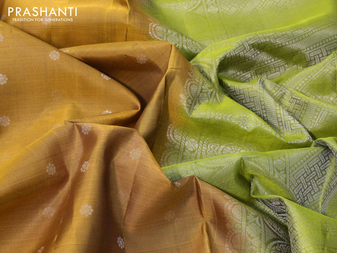 Pure soft silk saree mustard shade and light green with allover silver zari woven floral buttas and rettapet silver zari woven border