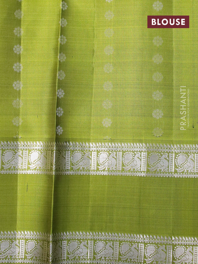 Pure soft silk saree mustard shade and light green with allover silver zari woven floral buttas and rettapet silver zari woven border