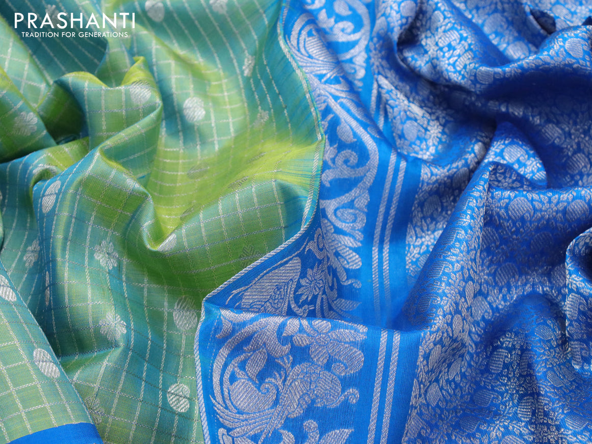 Venkatagiri silk saree dual shade of teal bluish green and cs blue with allover silver checks & butta weaves and long rich silver zari woven border