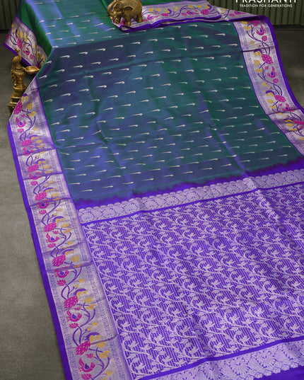 Venkatagiri silk saree dual shade of bluish green and royal blue with silver zari woven muniya buttas and silver zari woven paithaini border