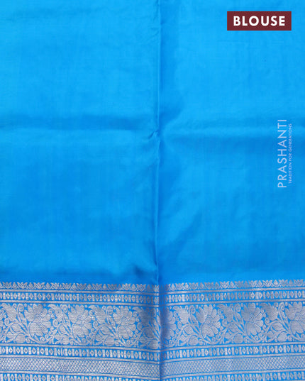 Venkatagiri silk saree dual shade of teal bluish green and cs blue with allover silver zari buttas and floral silver zari woven border