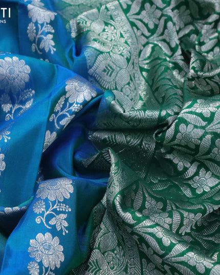 Venkatagiri silk saree dual shade of bluish green and green with allover floral silver zari woven weaves and long peacock design silver zari woven border