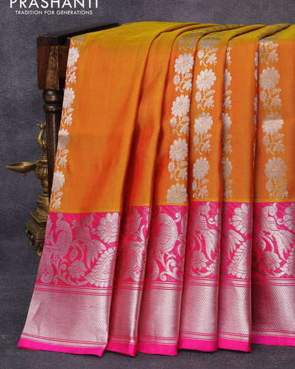 Venkatagiri silk saree dual shade of mustard yellow and pink with allover floral silver zari woven weaves and long peacock design silver zari woven border