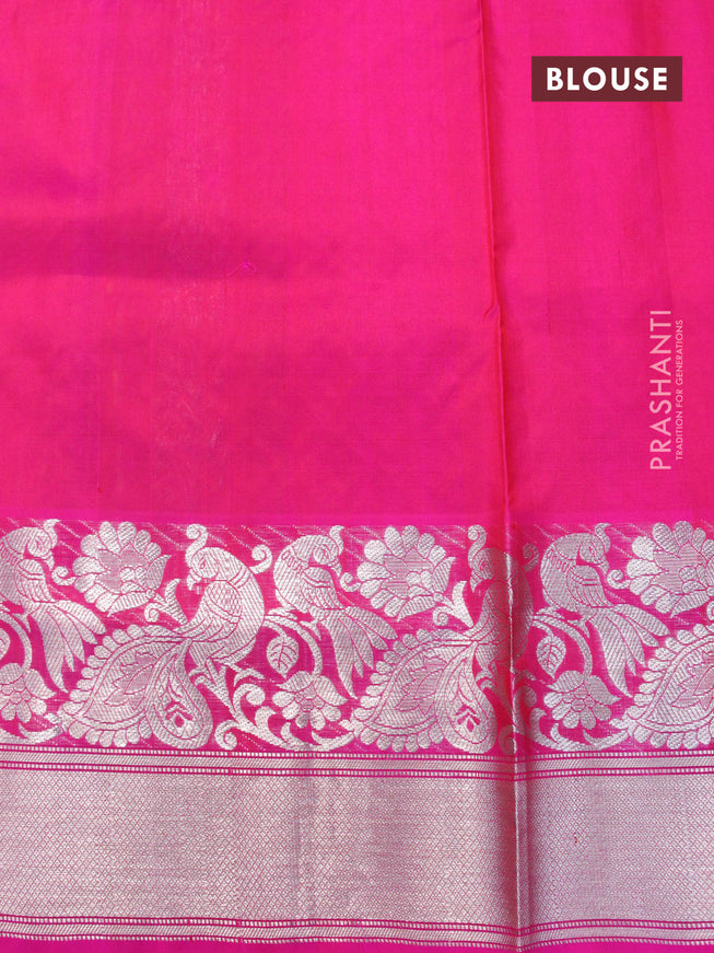 Venkatagiri silk saree dual shade of mustard yellow and pink with allover floral silver zari woven weaves and long peacock design silver zari woven border
