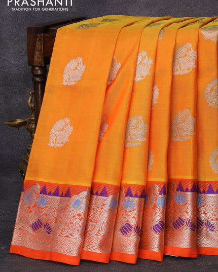 Venkatagiri silk saree mango yellow and orange with silver zari woven floral buttas and rich silver zari woven peacock design paithani border