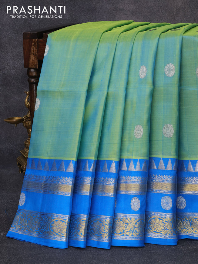 Venkatagiri silk saree dual shade of teal bluish green and cs blue with silver zari woven buttas and rich silver & gold zari woven border