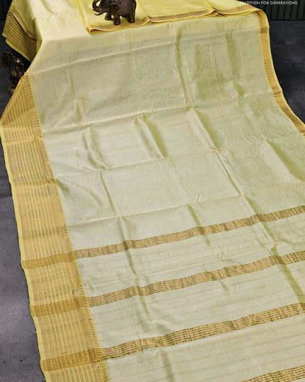 Mangalgiri silk cotton saree pale yellow and elephant grey with plain body and zari woven border & kalamkari hand painted blouse