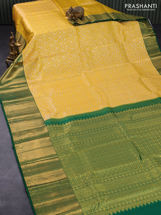 Pure kanjivaram silk saree mango yellow and green with allover silver zari woven floral brocade weaves and long rich zari woven floral border