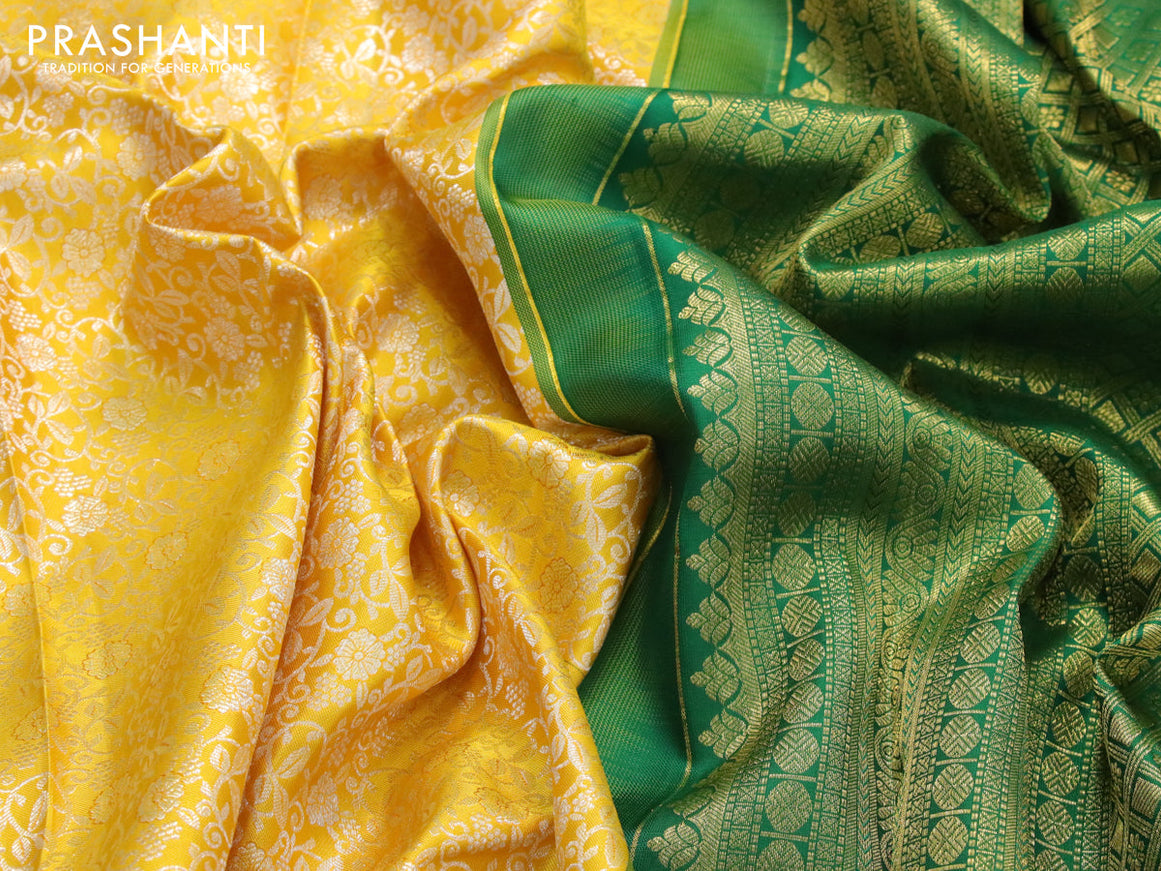 Pure kanjivaram silk saree mango yellow and green with allover silver zari woven floral brocade weaves and long rich zari woven floral border