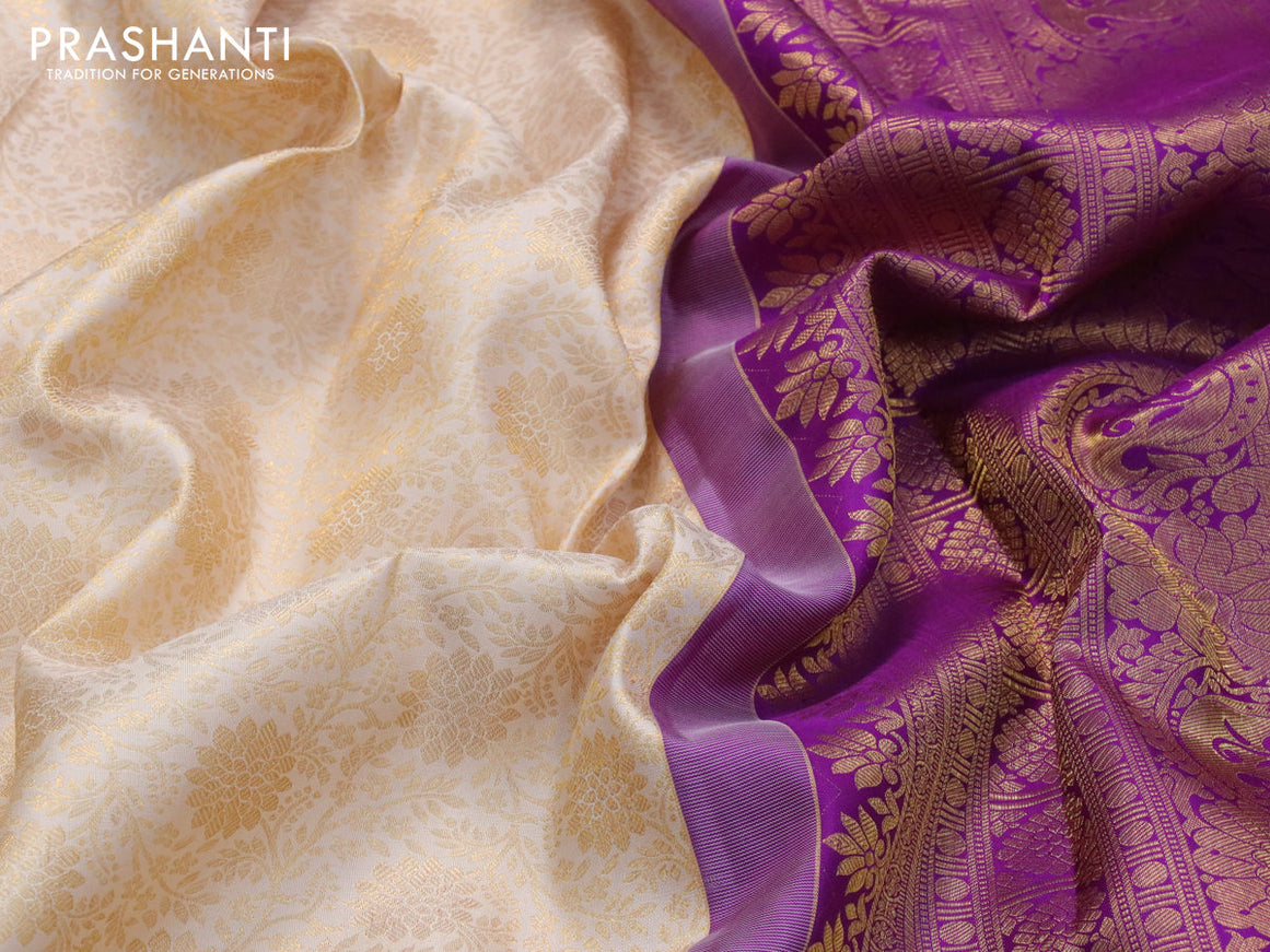 Pure kanjivaram silk saree cream and purple with allover zari woven floral brocade weaves and long rich zari woven floral border