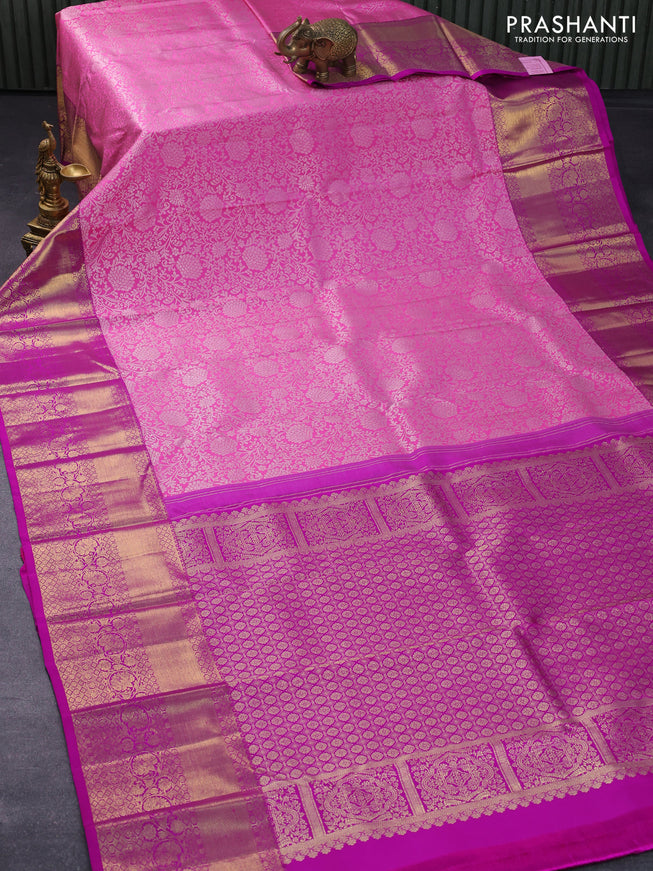 Pure kanjivaram silk saree light pink and purple with allover silver zari woven floral weaves and long zari woven floral border