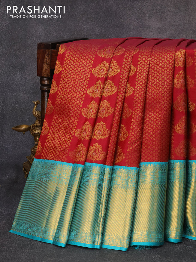 Pure kanjivaram silk saree maroom and teal blue with allover zari weaves & buttas and long zari woven floral border