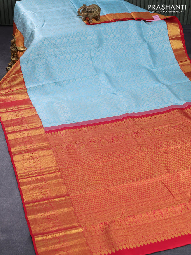 Pure kanjivaram silk saree light blue and red with allover zari woven brocade weaves and long rich zari woven border