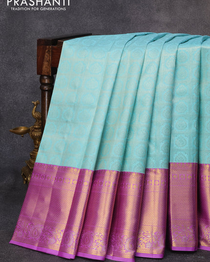 Pure kanjivaram silk saree teal blue and lavender with allover silver zari woven brocade weaves and long rich zari woven border