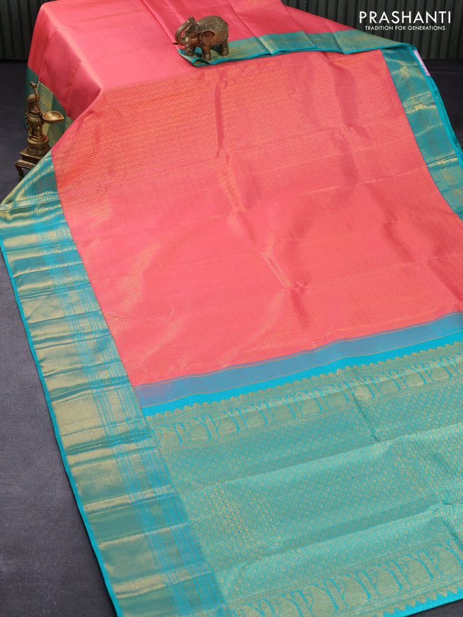 Pure kanjivaram silk saree peach pink and teal green with allover zari woven brocade weaves and rich zari woven border