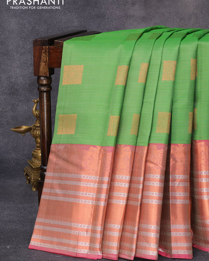 Pure kanjivaram silk saree green and pink with allover silver & copper zari woven stripe & buttas and long rich zari woven border